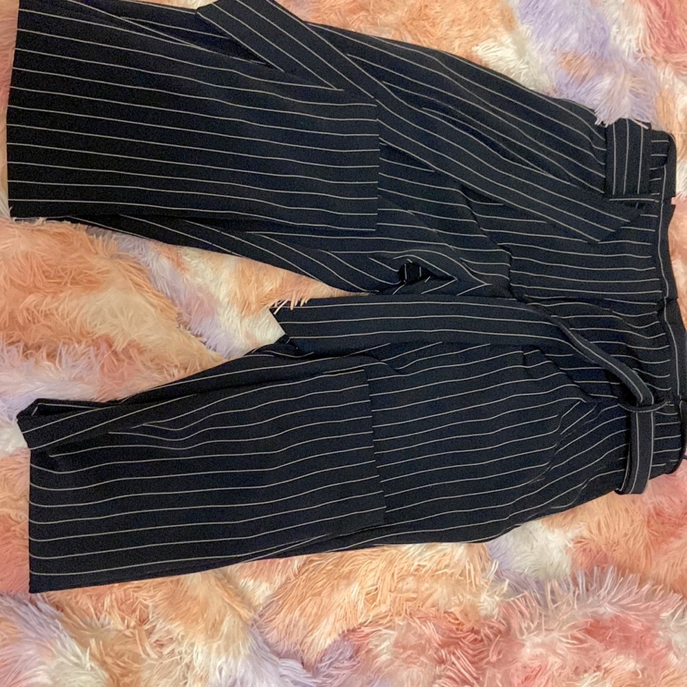 Black and white striped flare pants with belt